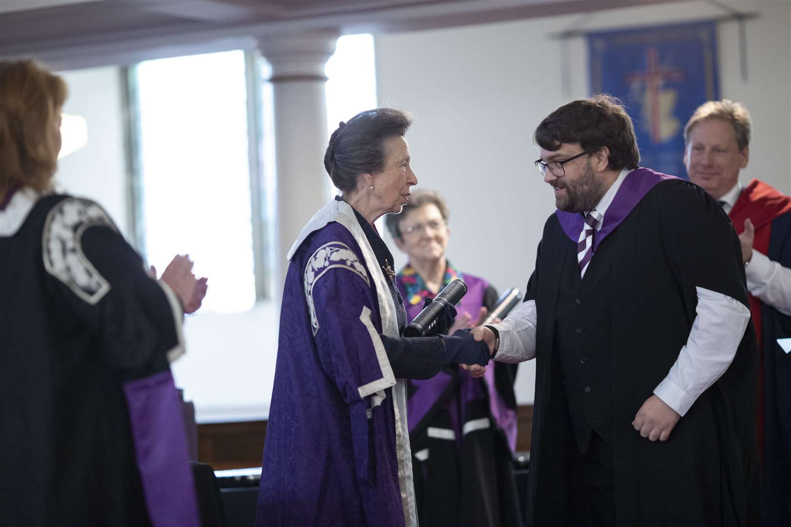 Thomas Thompson is congratulated by Princess Anne.