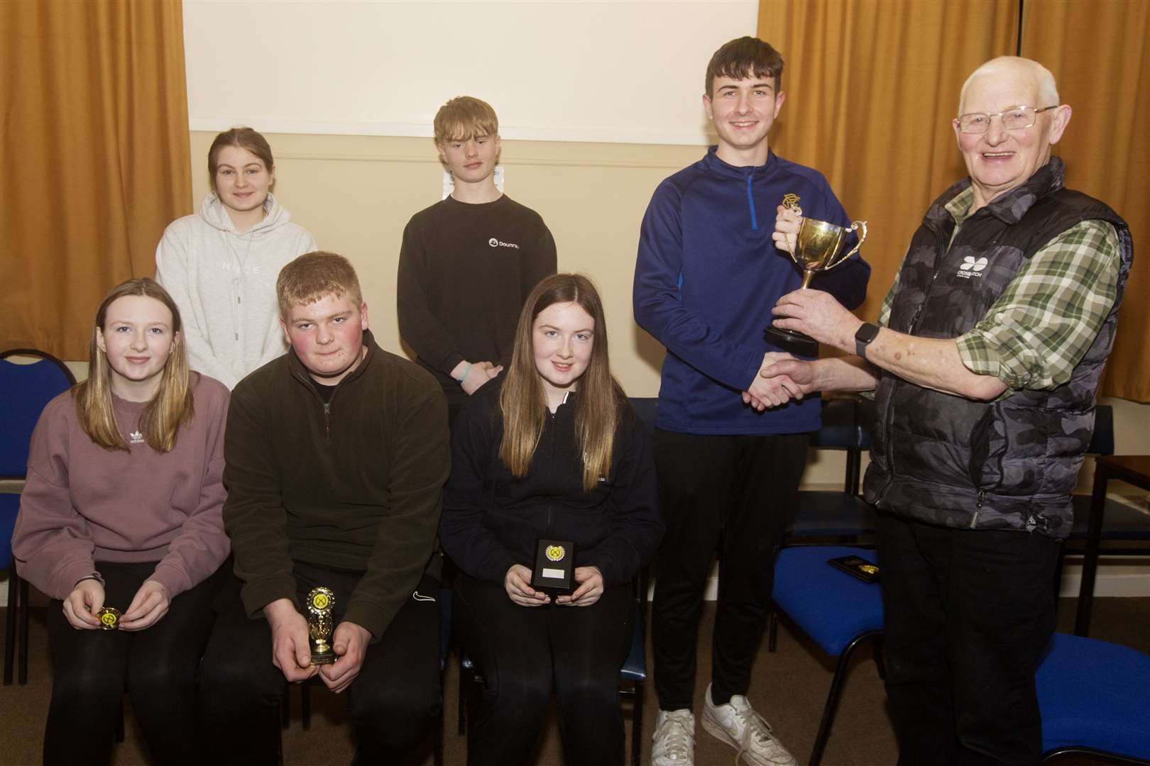 Ross Sutherland of Halkirk won Caithness Small Bore Rifle Association's annual indoor junior championship, held in Lieurary hall. Ross, pictured receiving his trophy from Jim Manson (right), scored 287 points, one more than his clubmate Sophie Campbell (front, right), who was runner-up on 286 points. Looking on are other junior shooters who took part in the championship. Front (from left): Grace Campbell, Halkirk; Luke Taylor, Westfield, who also won the Division Two junior league; (back) Iona Simpson, Wick Old Stagers; and John Bremner, Halkirk. Picture: Robert MacDonald / Northern Studios
