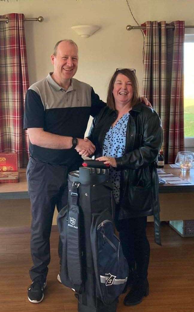 Andrew Taylor with Maryjane Campbell after he won a nearest-the-pin prize at Reay Golf Club's recent Ronnie Campbell Open. Taylor went on to win the gents' January Medal.