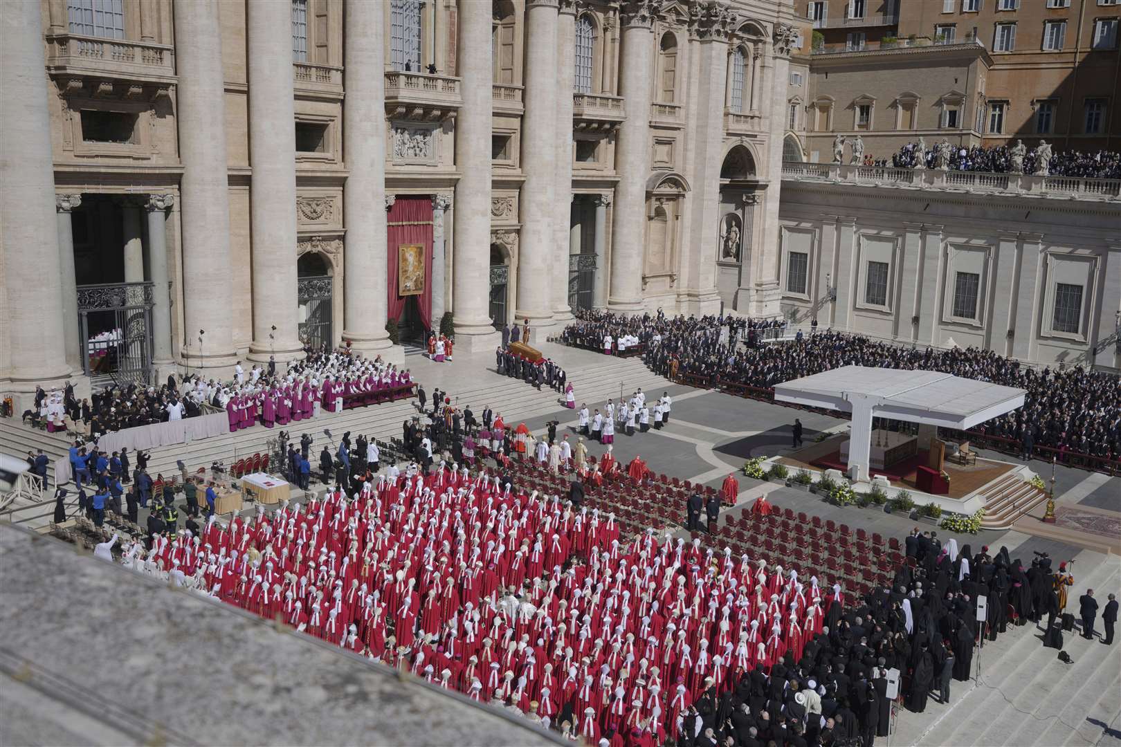 Thousands watched on as the coffin was carried into St Peter’s Square (Markus Schreiber/AP)