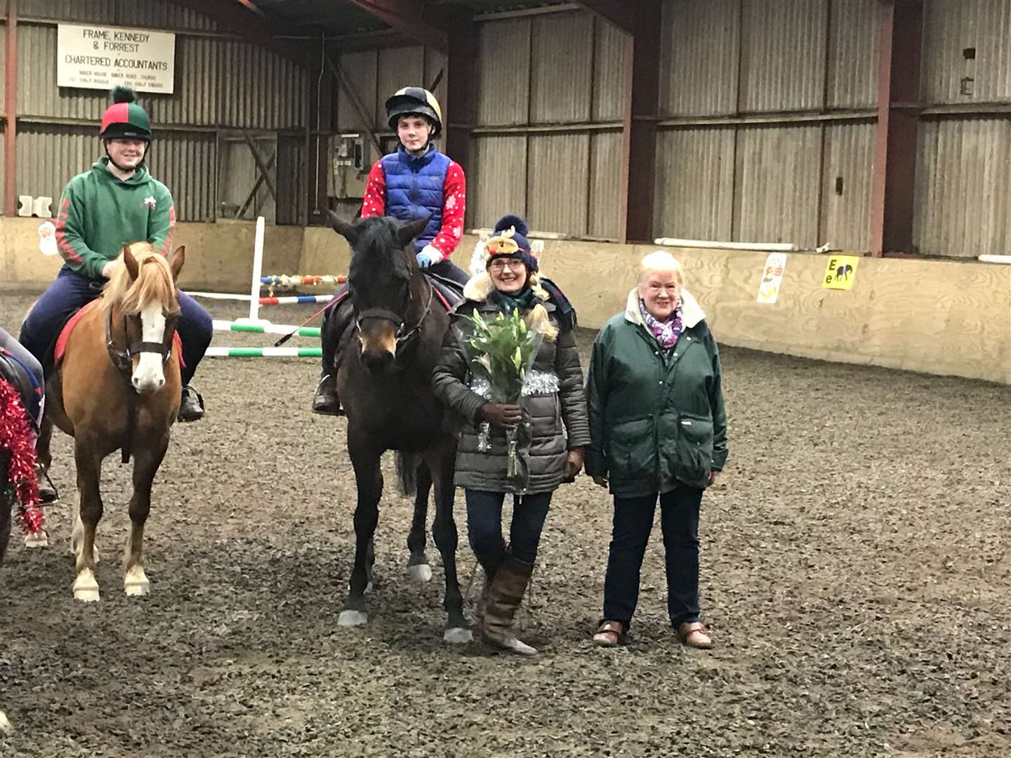 Retiring district commissioner Linda Ramsøy (second from the right), is pictured standing with honorary president Jessie Allan, along with pony club members Benjamin Rogers (left) and Liam Mackenzie.