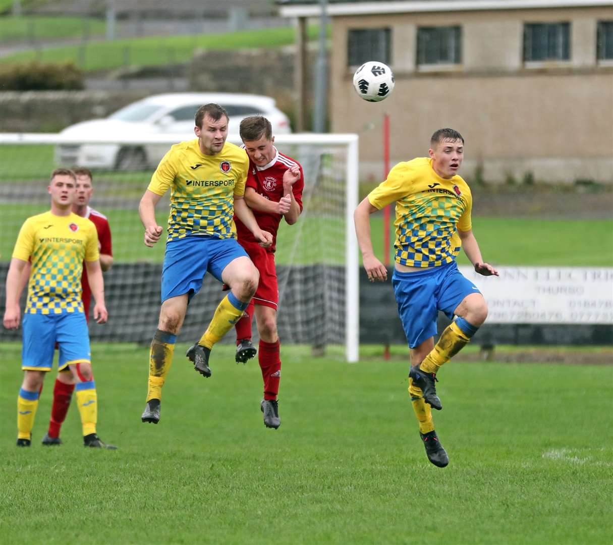 Orkney's Owen Rendall in an aerial duel with Grant Aitkenhead of Thurso. Picture: James Gunn