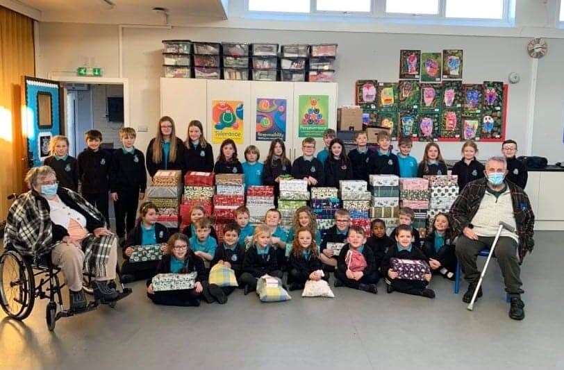 Melvich pupils with Anne Demmon and Andrew Frier from Melvich care home who donated boxes to the appeal.