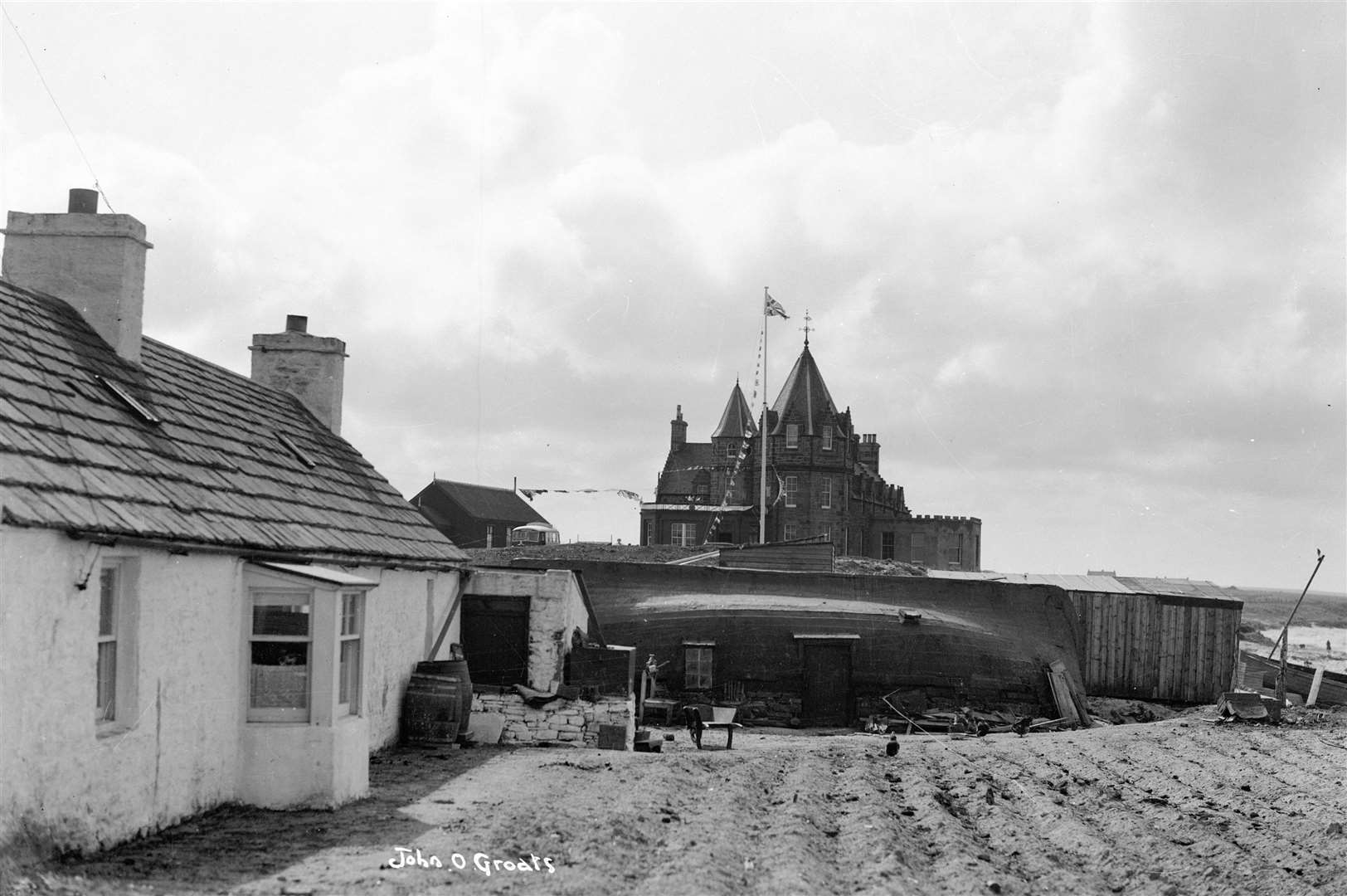 An archive view of John O'Groats showing the Last House on the left. The building is believed to date back more than a century. Picture from the Johnston Collection, reproduced courtesy of The Wick Society