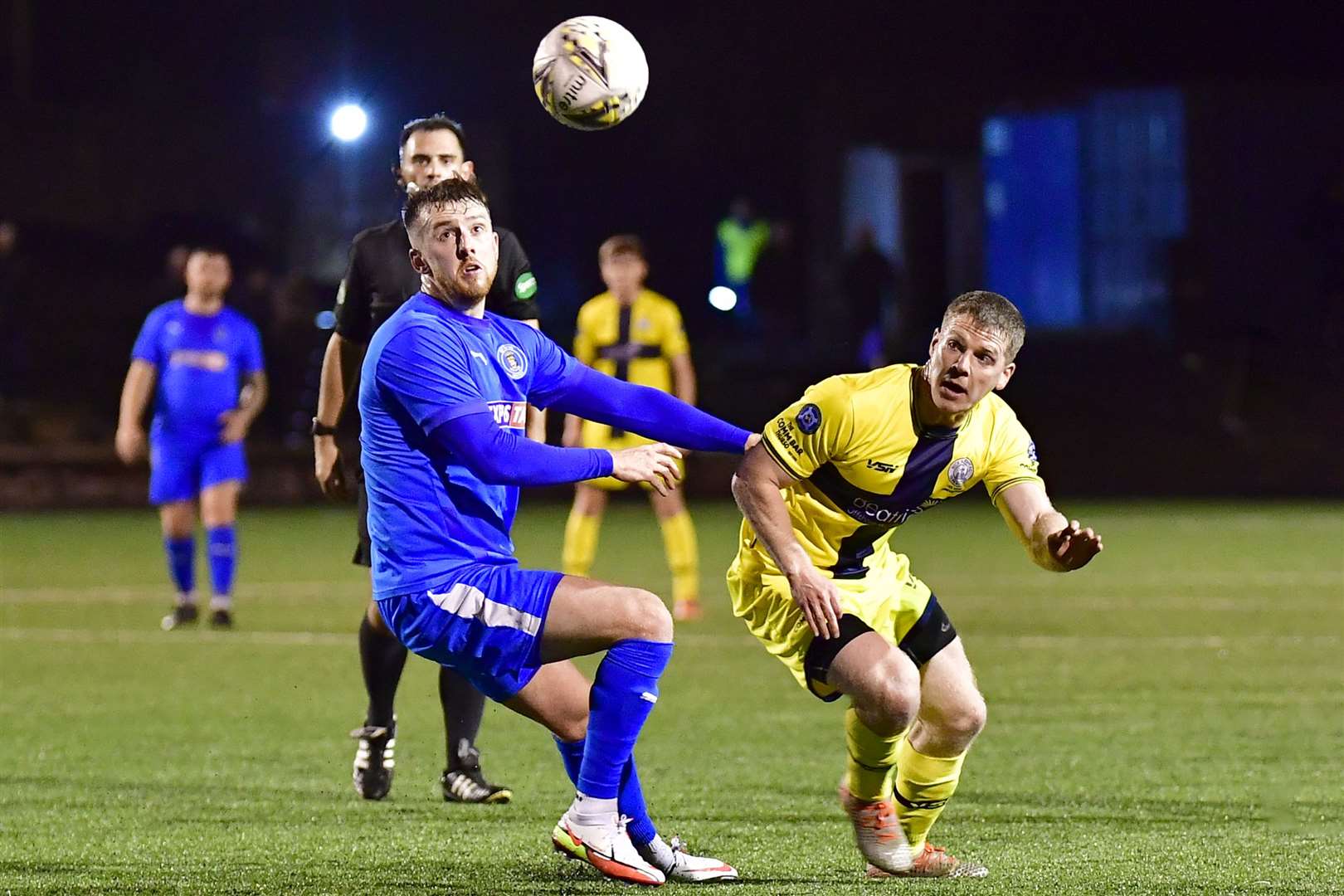 Wick Academy's Davie Allan and Bo'ness United's Lewis Hawkins have their eyes on the ball during the rearranged Scottish Cup replay at Newtown Park on Tuesday night. Picture: Mel Roger