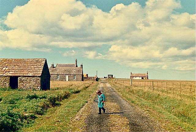Young Jamie Nicol exploring the deserted road on Stroma in 1987.