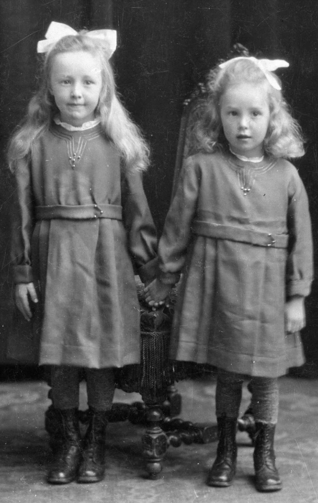 A studio portrait from 1921 showing Peggy Ross and her sister, thought to be called Janet, who were pupils at Shebster school.