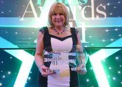 Sylvia Craine, clinical specialist physiotherapist for continence based at Caithness General Hospital, with the two Nursing Times Awards which were presented at a ceremony held at London’s Hilton Hotel.