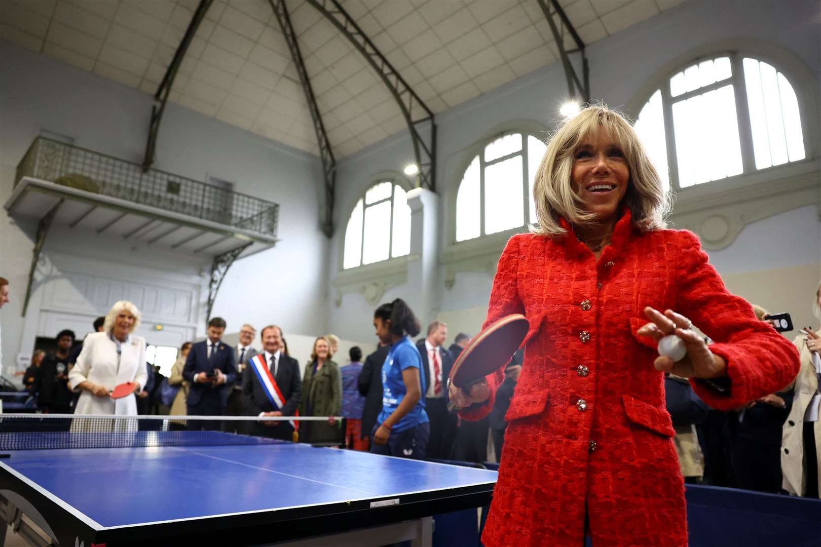 The Queen plays table tennis with Brigitte Macron (Hannah McKay/PA)
