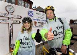Mark Taylor and Lorna Stanger at John O’Groats on Saturday at the end of their 600-mile cycle. Photo: Robert MacDonald.