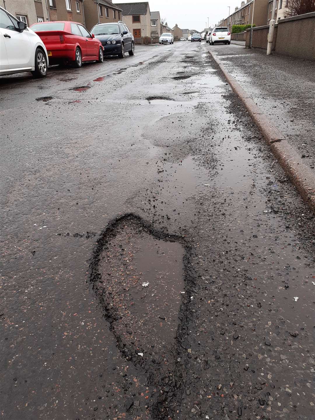 Potholed road surface in Wick's Glamis Road. Picture: CRR