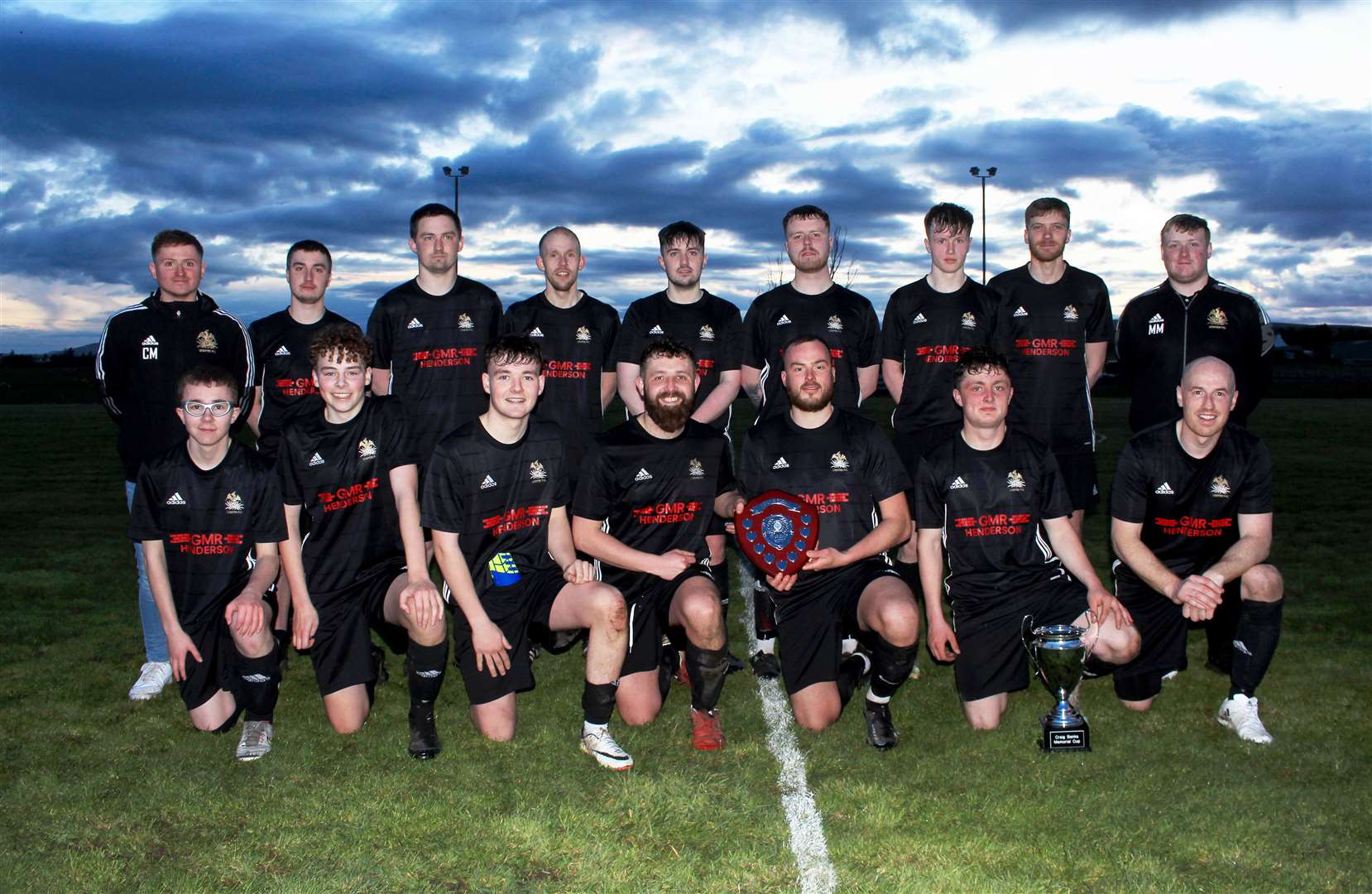 The Lybster team with the Craig Banks memorial trophies after Friday night's 3-1 win against Keiss. Lybster are wearing their new kit sponsored by GMR Henderson. Picture: Alan Hendry