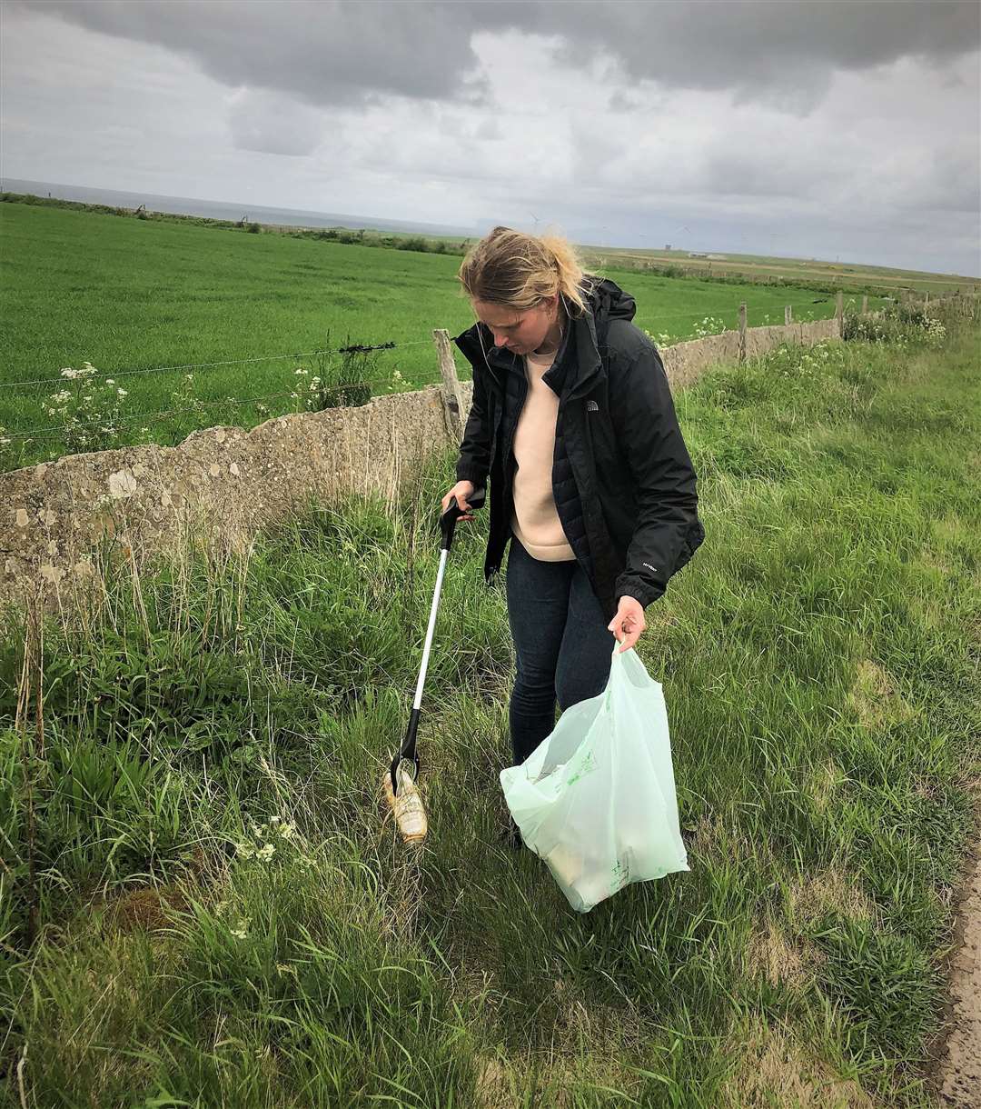 Elinor rubbish picking on road verges in the Dounreay area.