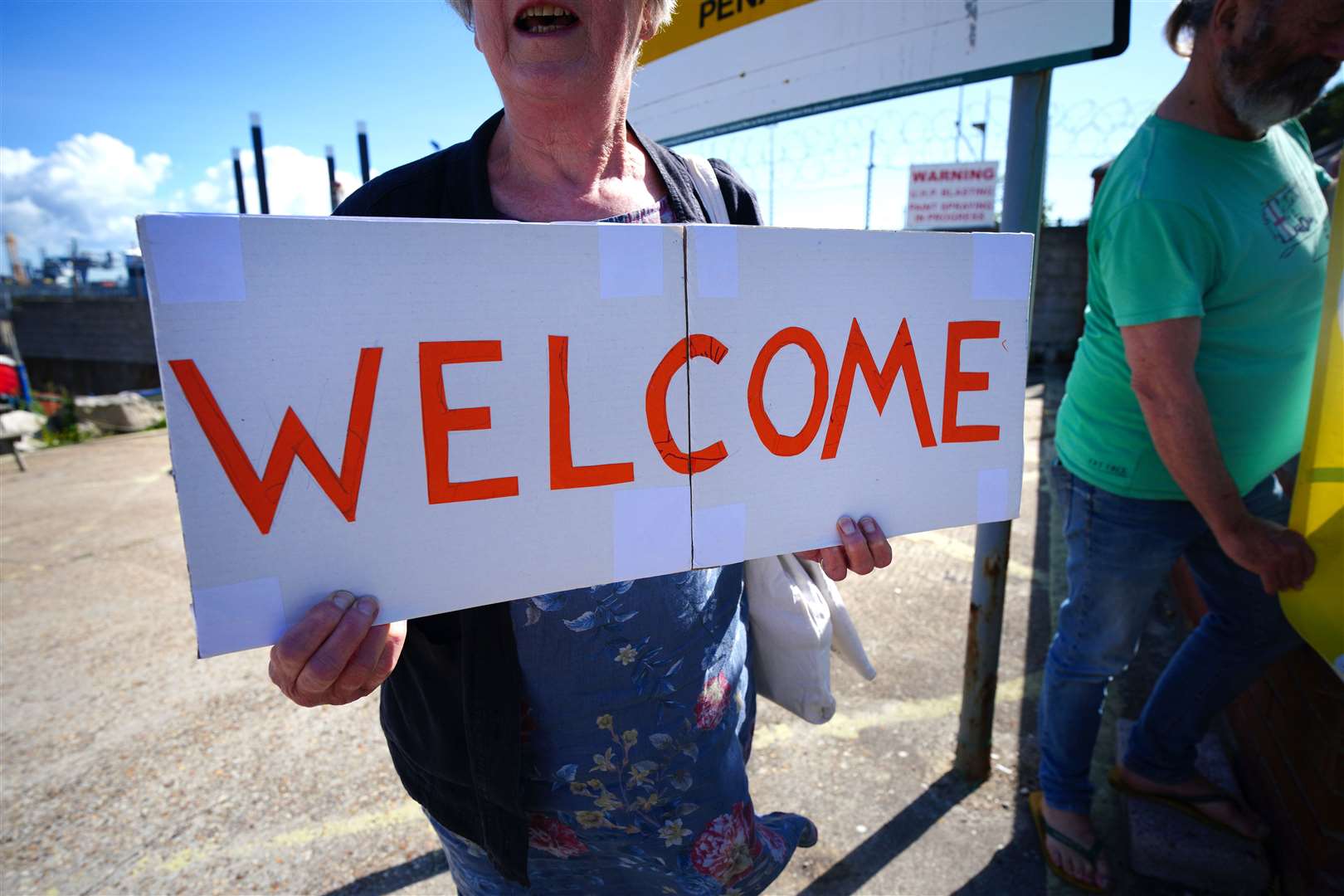 Supporters outside Portland Port in Dorset before the first asylum seekers arrive to board the Bibby Stockholm accommodation barge (Ben Birchall/PA)