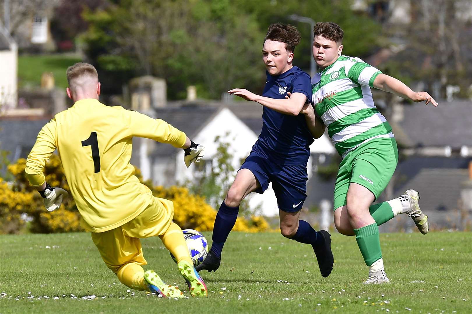 High Ormlie striker William Cannop runs at Helmsdale United keeper Cameron Yuill. Picture: Mel Roger