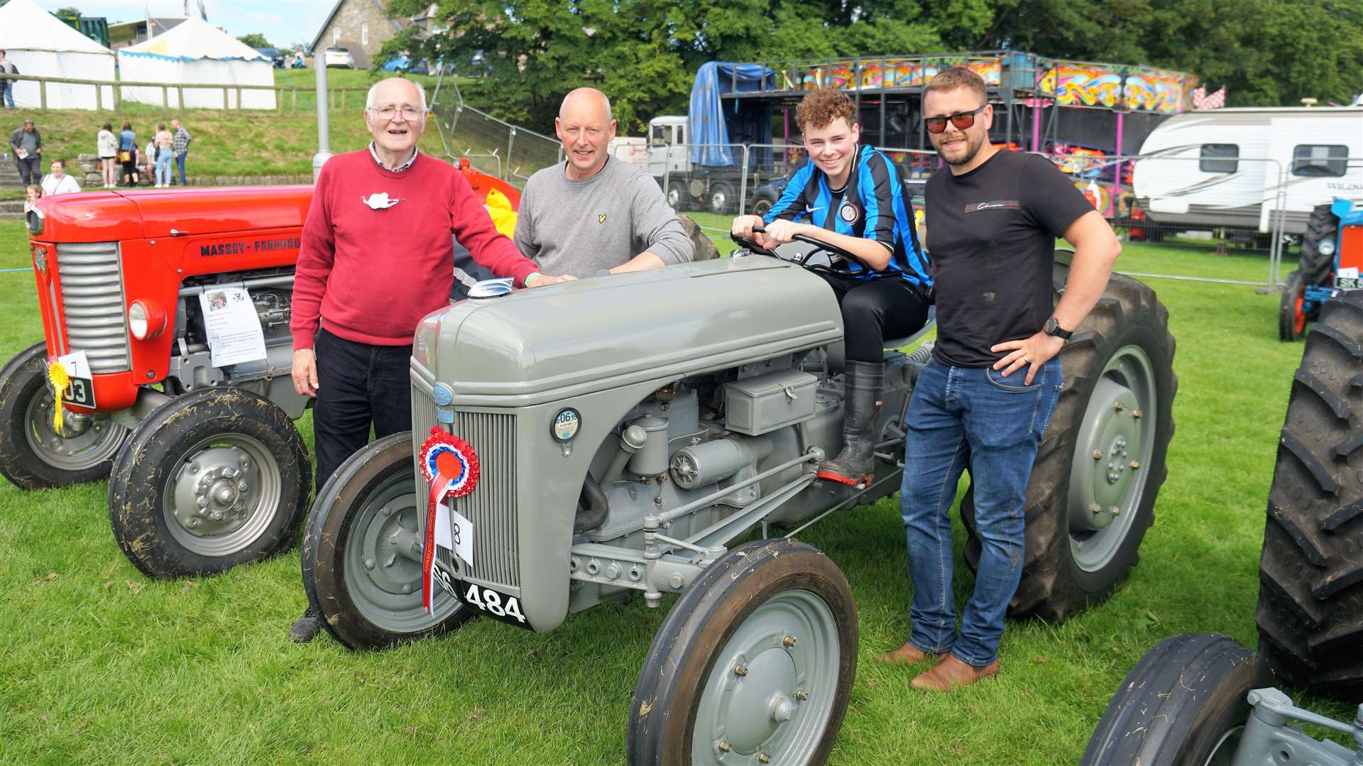 James and Elliot Cormack with Elliot Jr in the driving seat and Matthew Sutherland. James won an award for the vintage Ford Ferguson tractor he refurbished that dates from 1941. Picture: DGS