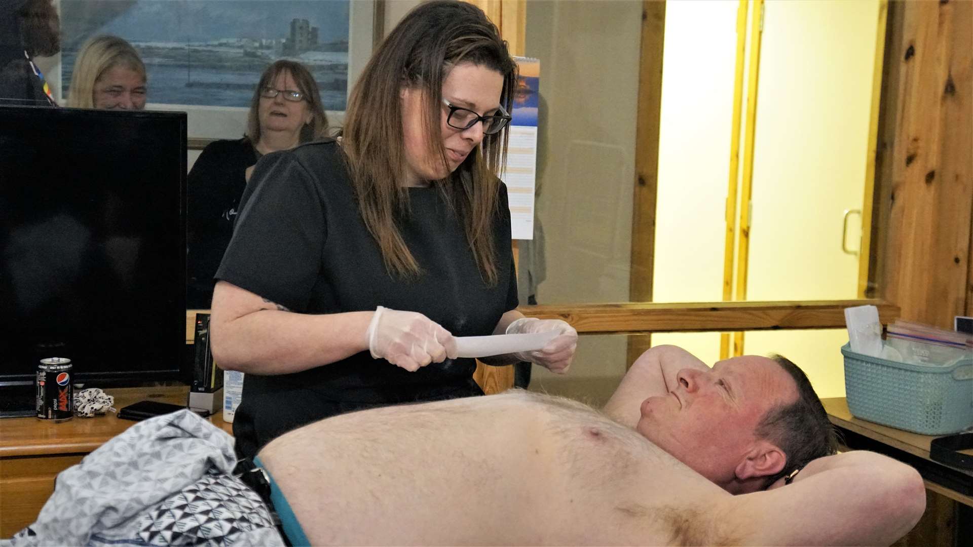 Murdo McConnell gets his chest waxed by Sophie-Ann Bain. Picture: DGS