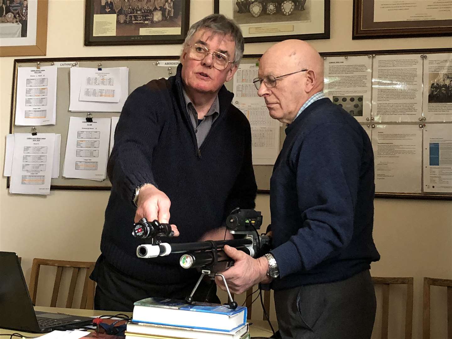 Donald Henderson (left) gives James Gunn, Carsgoe Farm, near Halkirk, some tips on the special air rifle used by visually-impaired shooters.
