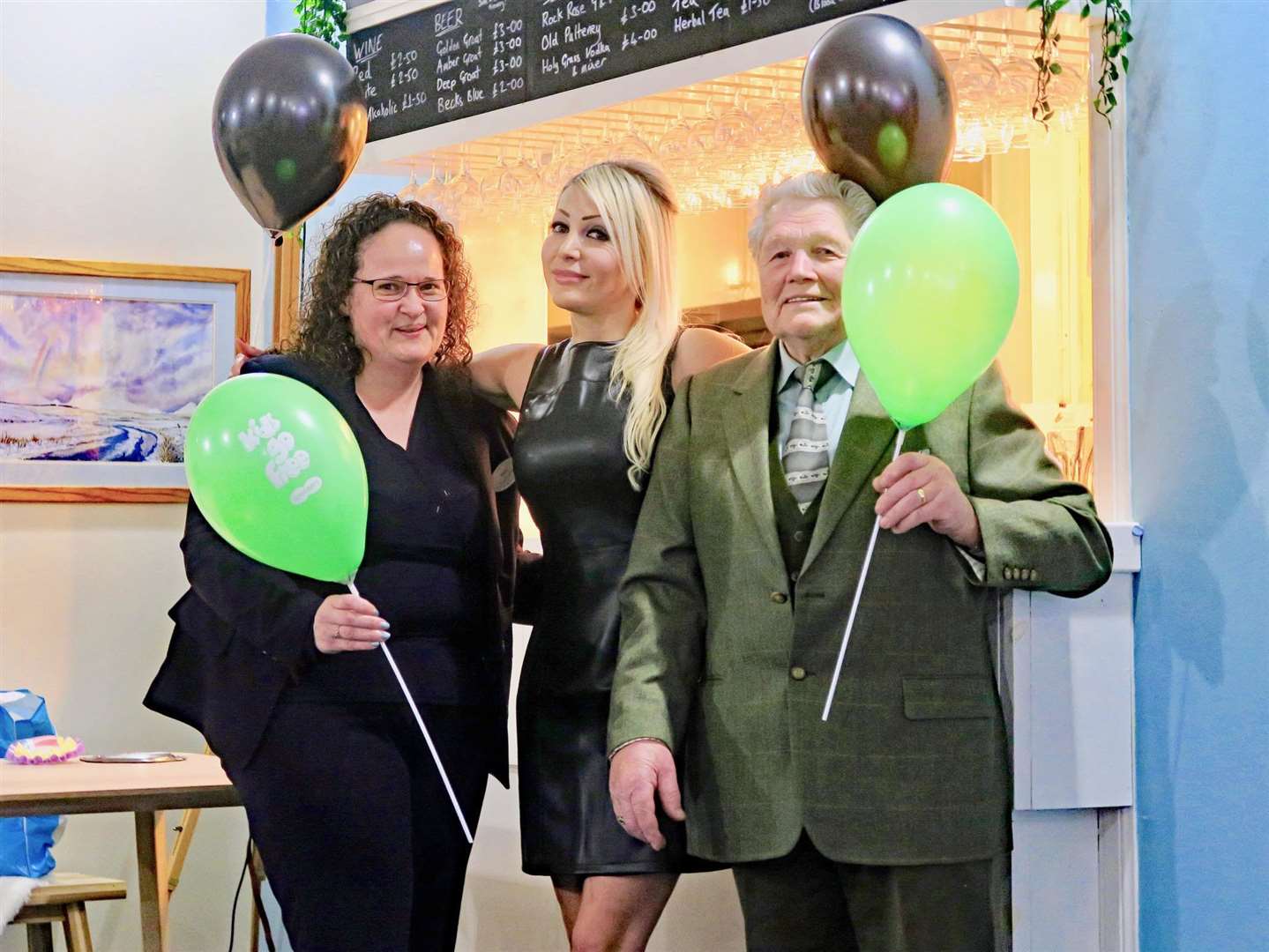 Marie Bell from Specsavers (left) with Natalie and special guest Don Sutherland enjoying some fun during the annual quiz.