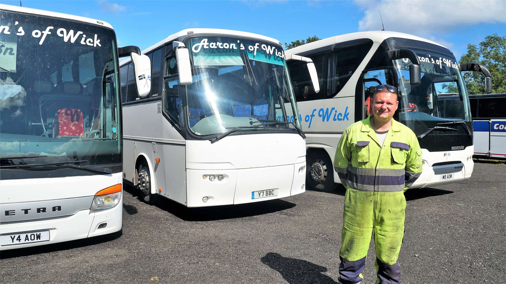 Aaron Wilson with some of his fleet of buses. Picture: DGS