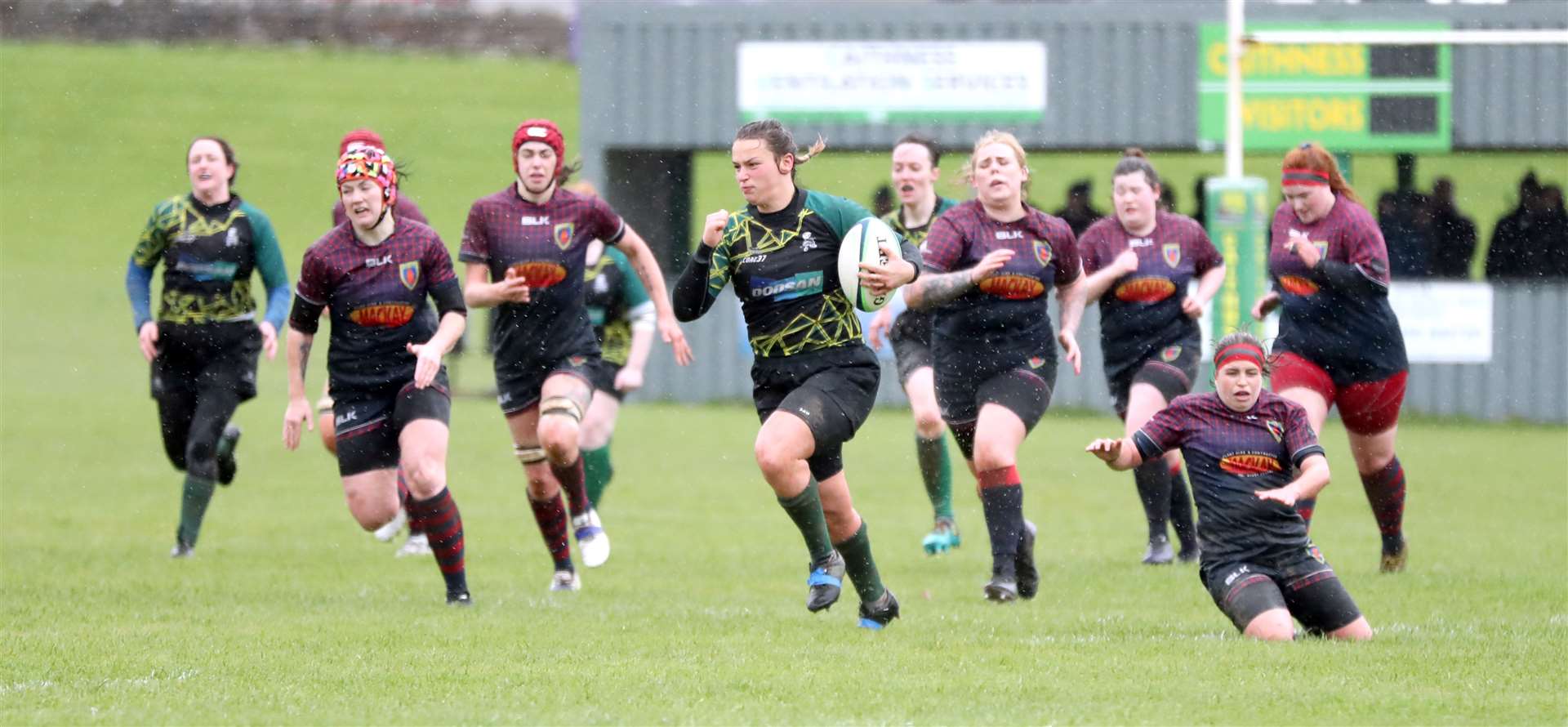 Emmy Smith leaves the Stornoway players in her wake as she sprints to the try line to score. Picture: James Gunn