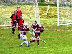Action from the latest shinty tussle between Farr High and Kinlochbervie at the school pitch at Bettyhill. Photo: Chloe Mackay.