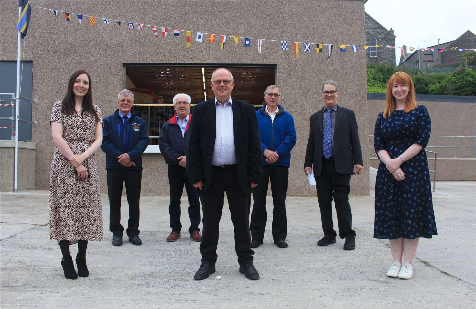 Ian Leith (centre), chairman of the Wick Society, in Cowie's yard with (from left) guest speaker Nicola Sinclair and board members Donald Henderson, Malcolm Bremner, Fergus Mather, Tony Sinclair and Lynsey Bremner. Picture: Alan Hendry