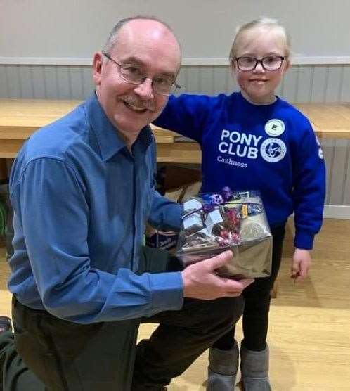 Lois Manson handed over a Caithness produce hamper to Jim Sudd.
