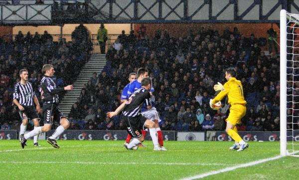 Magic moment for Elgin...Rangers keeper Neil Alexander fumbles the ball for the equaliser at Ibrox. Photo by Bob Crombie.