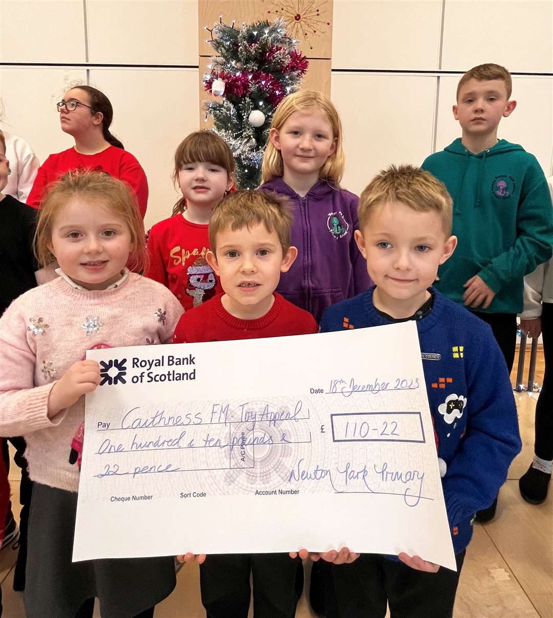 Newton Park pupils with the cheque for the Caithness FM Toy Appeal.