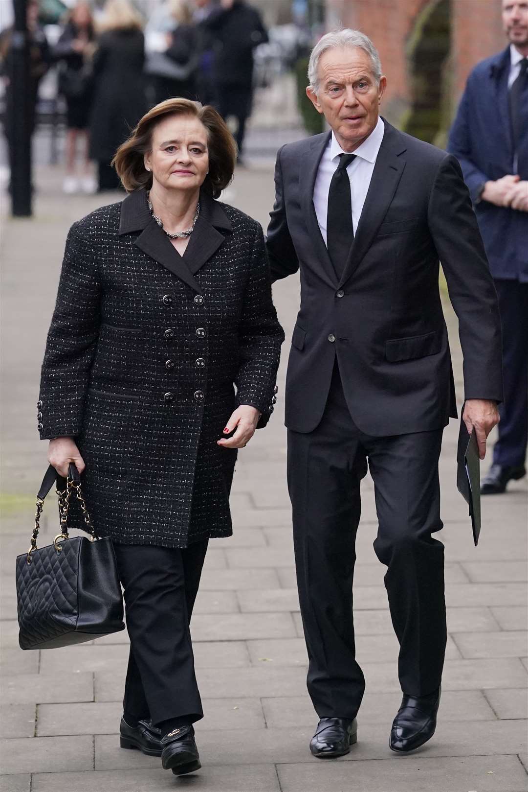 Former prime minister Sir Tony Blair and his wife Cherie Blair attend the funeral service of Derek Draper (Jonathan Brady/PA)