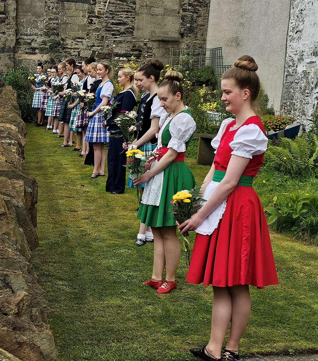 Some of Elise Lyall's dancers preparing to place bunches of flowers at the memorial garden in Bank Row. Picture: John Mackenzie