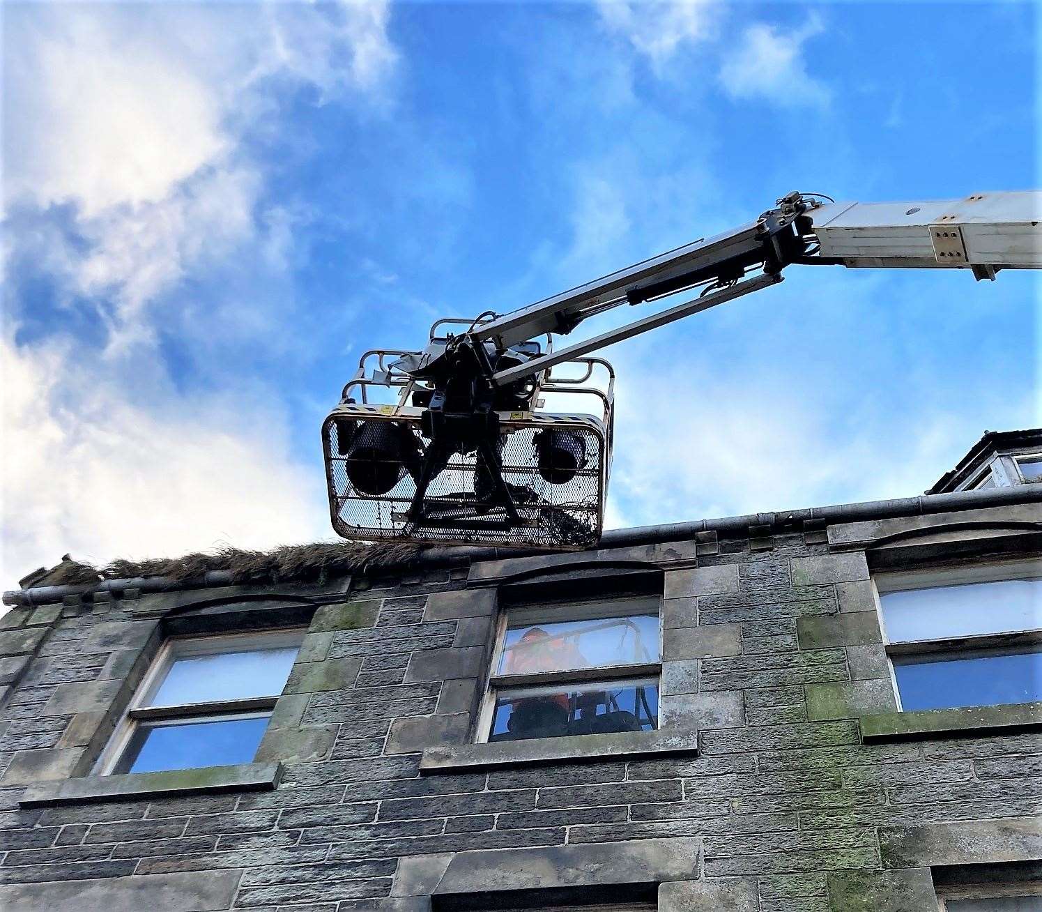 Cleaning out grass and weeds from the property above the Nickel and Dime shop on High Street. 12 buckets of weeds and grass were removed from this one address. Picture: Jonathan Miller