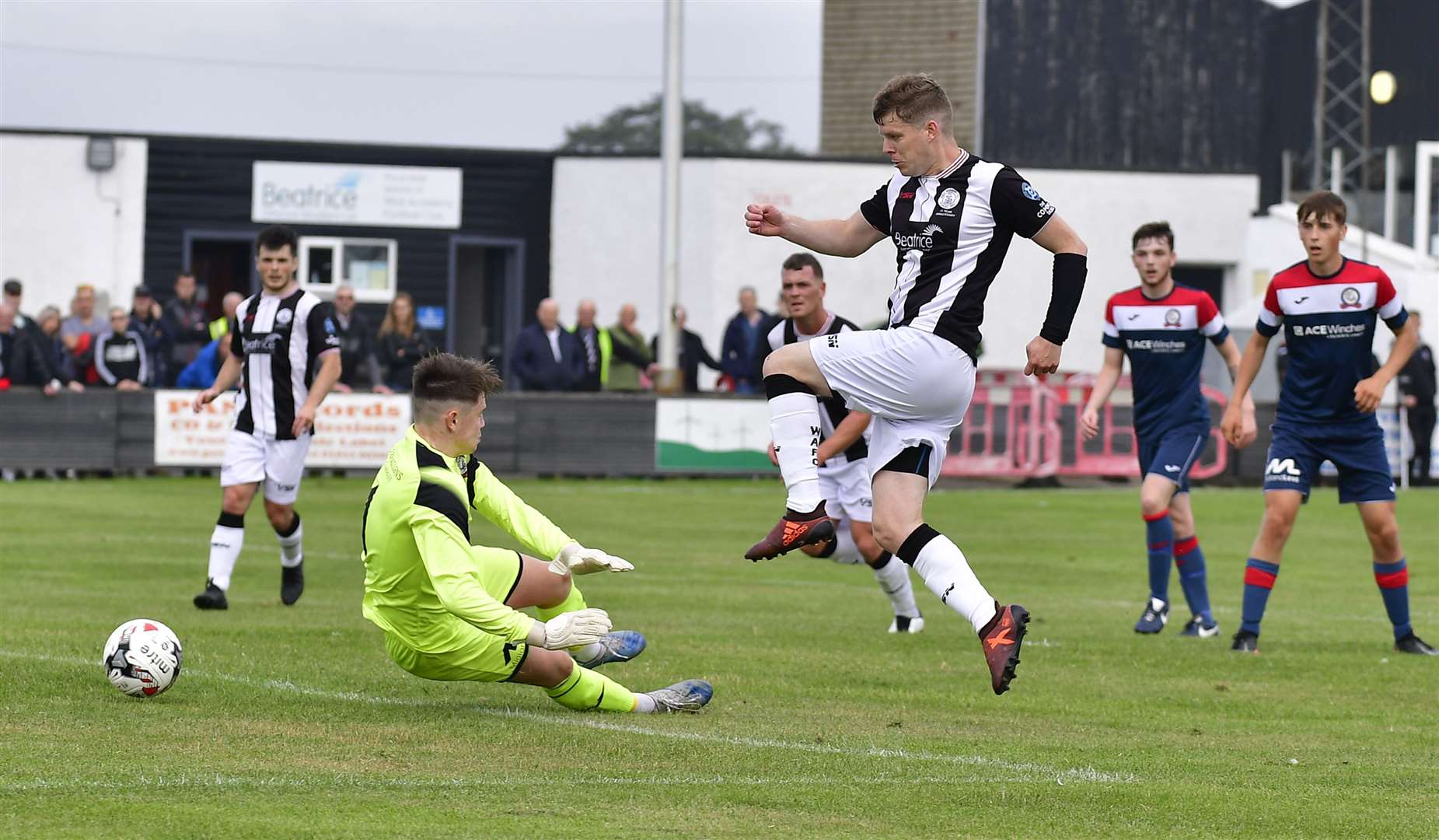 Ross Allan knocks the ball past Turriff United keeper Tim Findlay to put Wick Academy in front when the teams met at Harmsworth Park in August. The match ended 1-1. Picture: Mel Roger