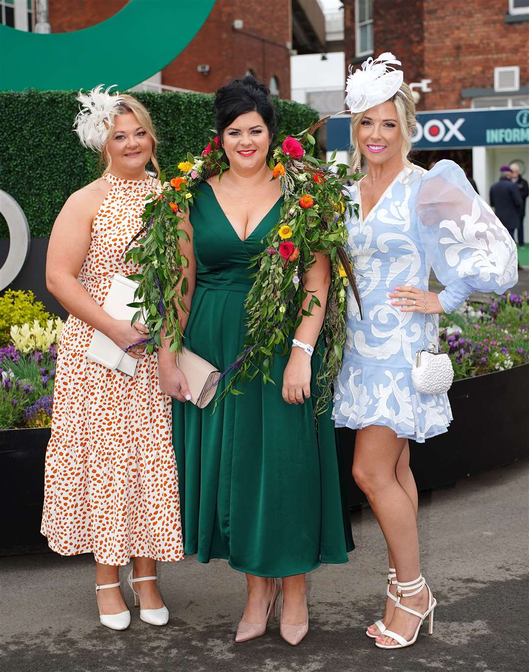 Gemma Slater, Charlotte Graham and Amanda Warnock pose for a photograph on day two of the Randox Grand National Festival at Aintree Racecourse, Liverpool (Peter Byrne/PA)