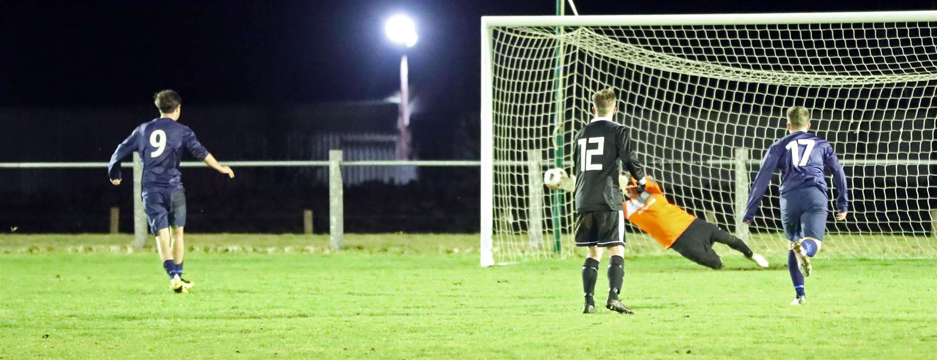 Graham MacNab fires his spot-kick past Thurso keeper Asa Sinclair to round off the scoring in Halkirk United's 4-1 win against Thurso on Tuesday night. Picture: James Gunn