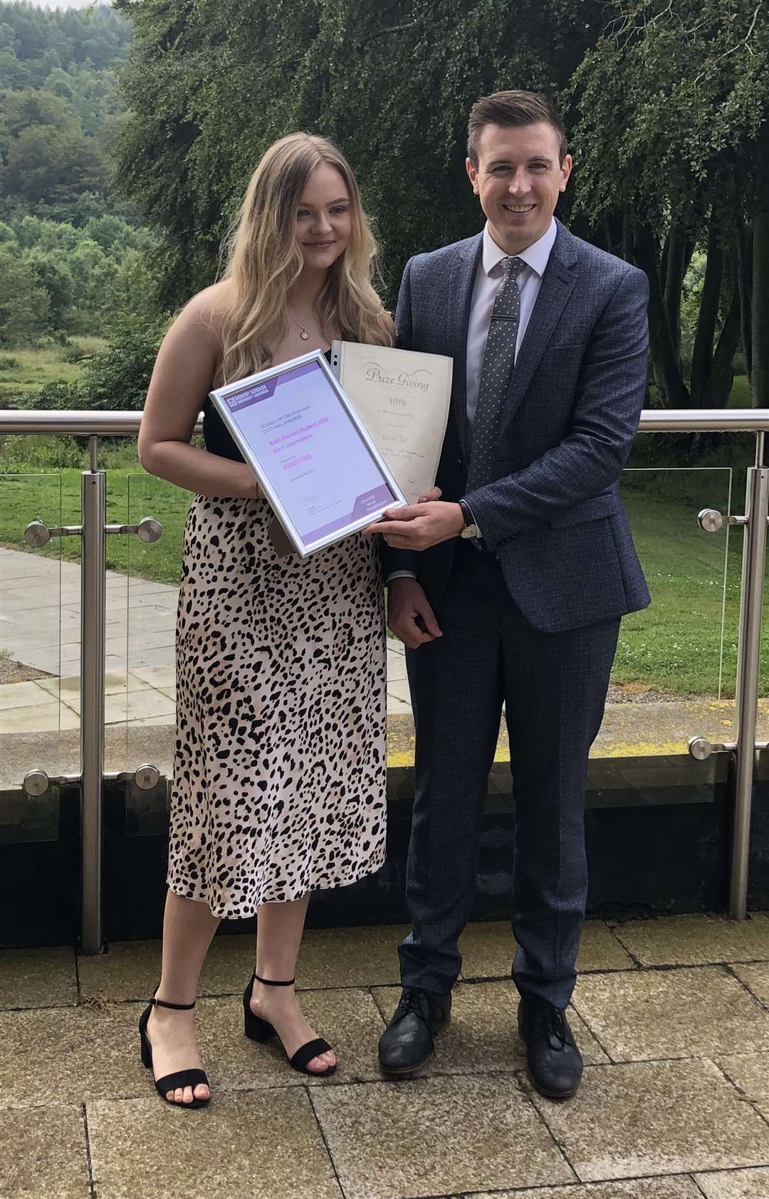 Kirstin Tait being presented with her RGU third-year journalism student of the year award from STV presenter Ben Philip.