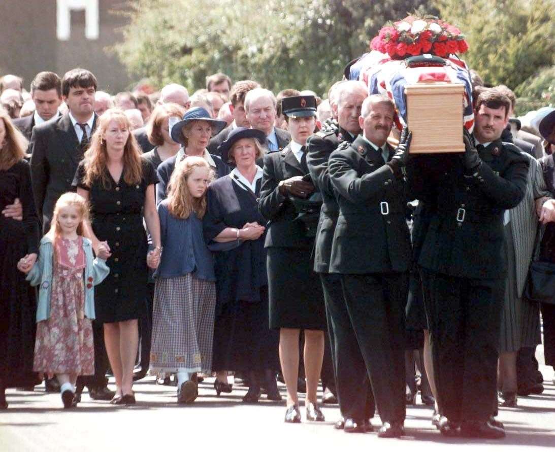 The family and friends of RUC officer John Graham follow his coffin in Richill, Co Armagh (John Giles/PA)