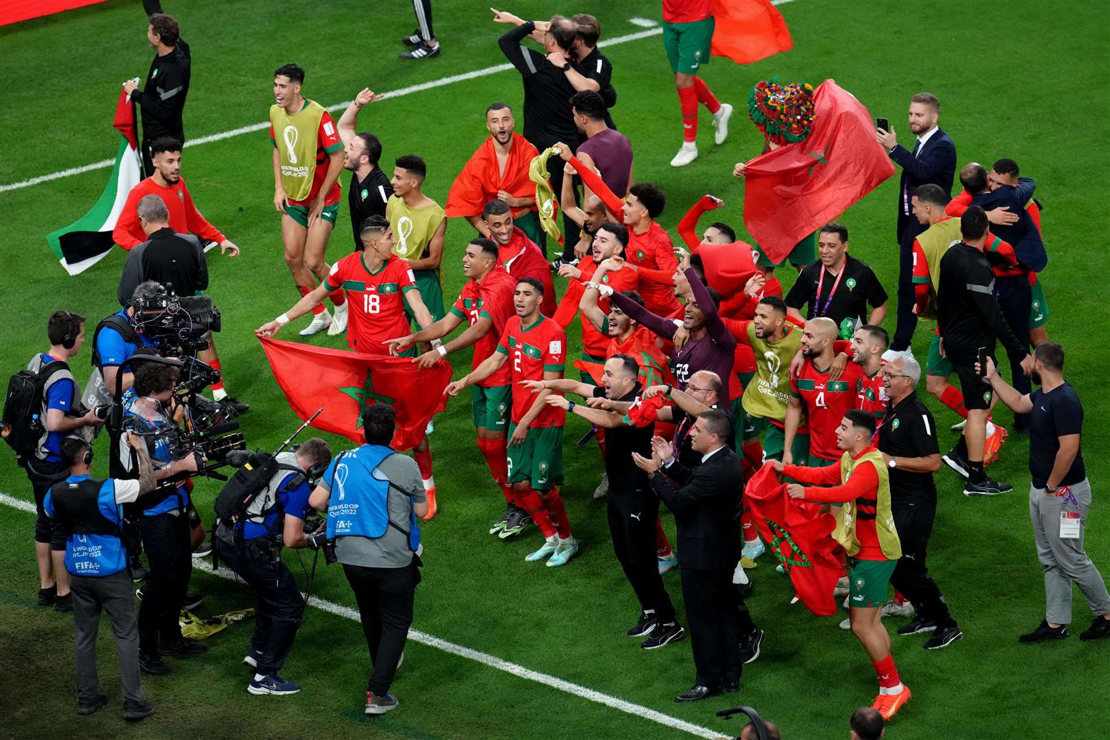 Morocco players celebrate winning the penalty shootout (Nick Potts/PA)
