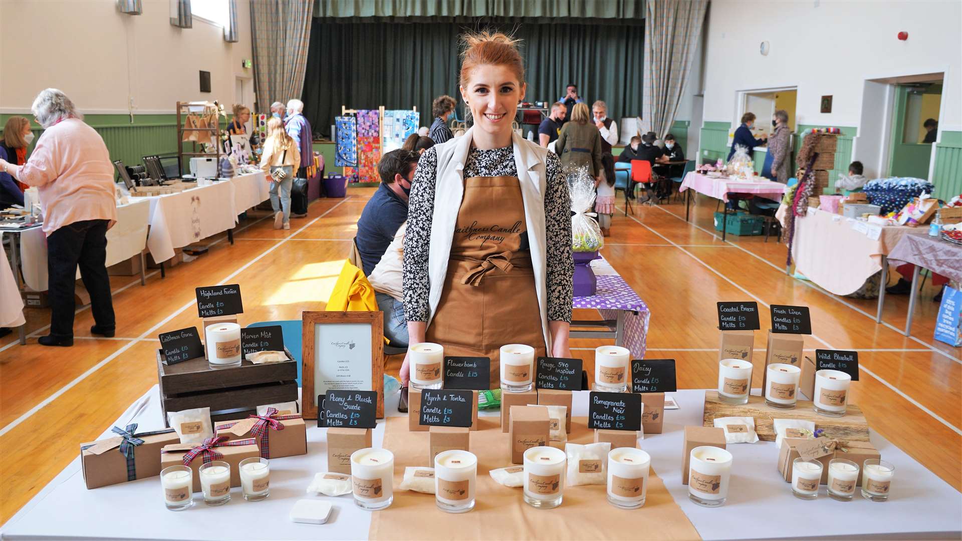 Bronwyn Ross from Caithness Candle Company with a selection of her candles and melts at recent fair in Watten. Picture: DGS