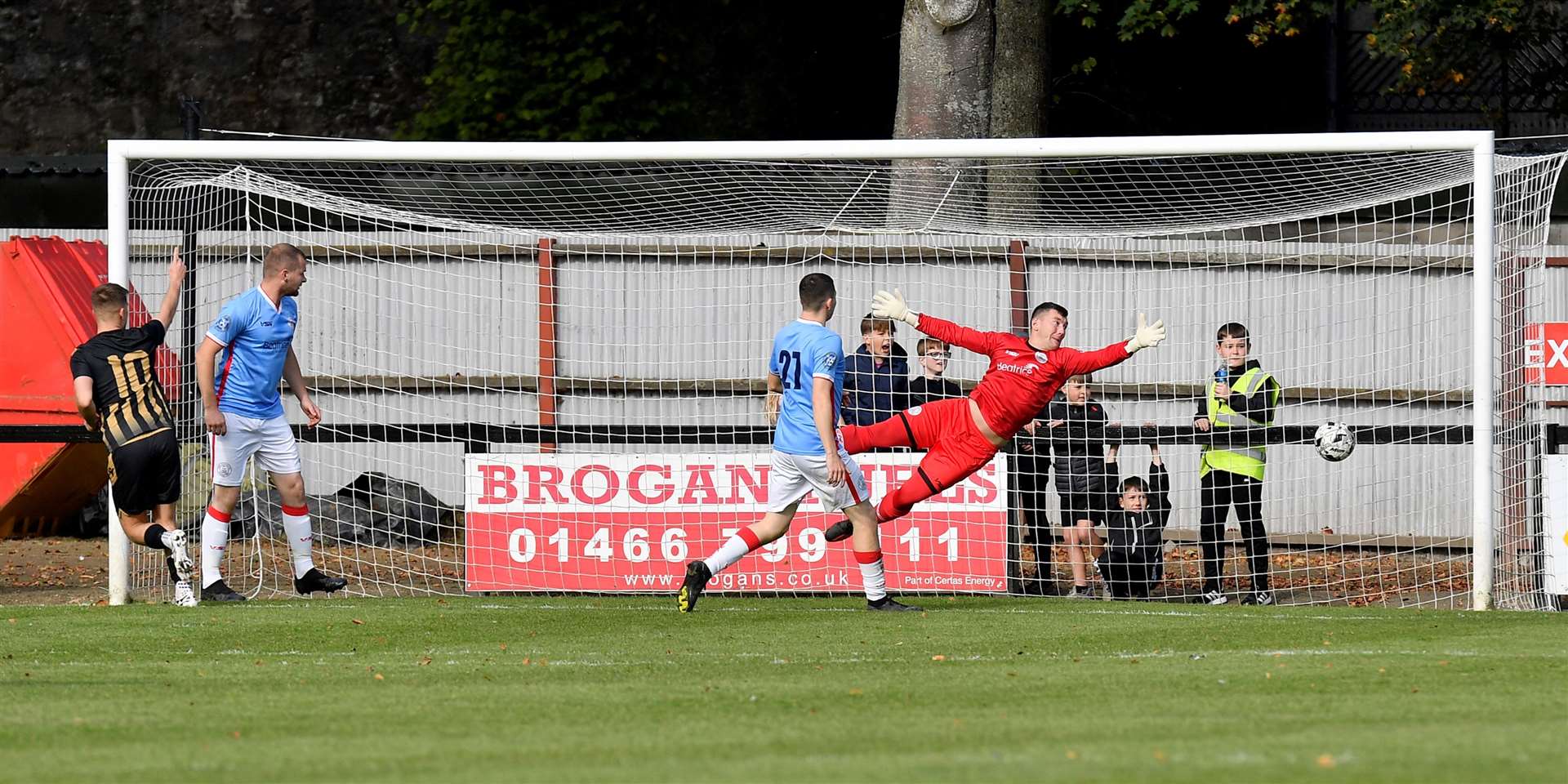 Huntly's in-form striker Angus Grant scoring in the Scottish Cup first-round tie against Academy at Christie Park in September. The Black-and-Golds went on to win on penalties. Picture: Mel Roger