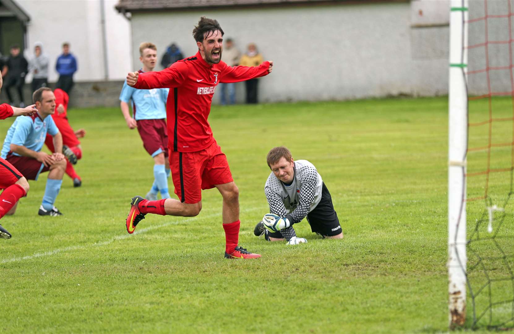 Wick Groats' Graham MacNab turns away to celebrate their first goal in the 3-1 Eain Mackintosh Cup final win against Pentland United. Picture: James Gunn