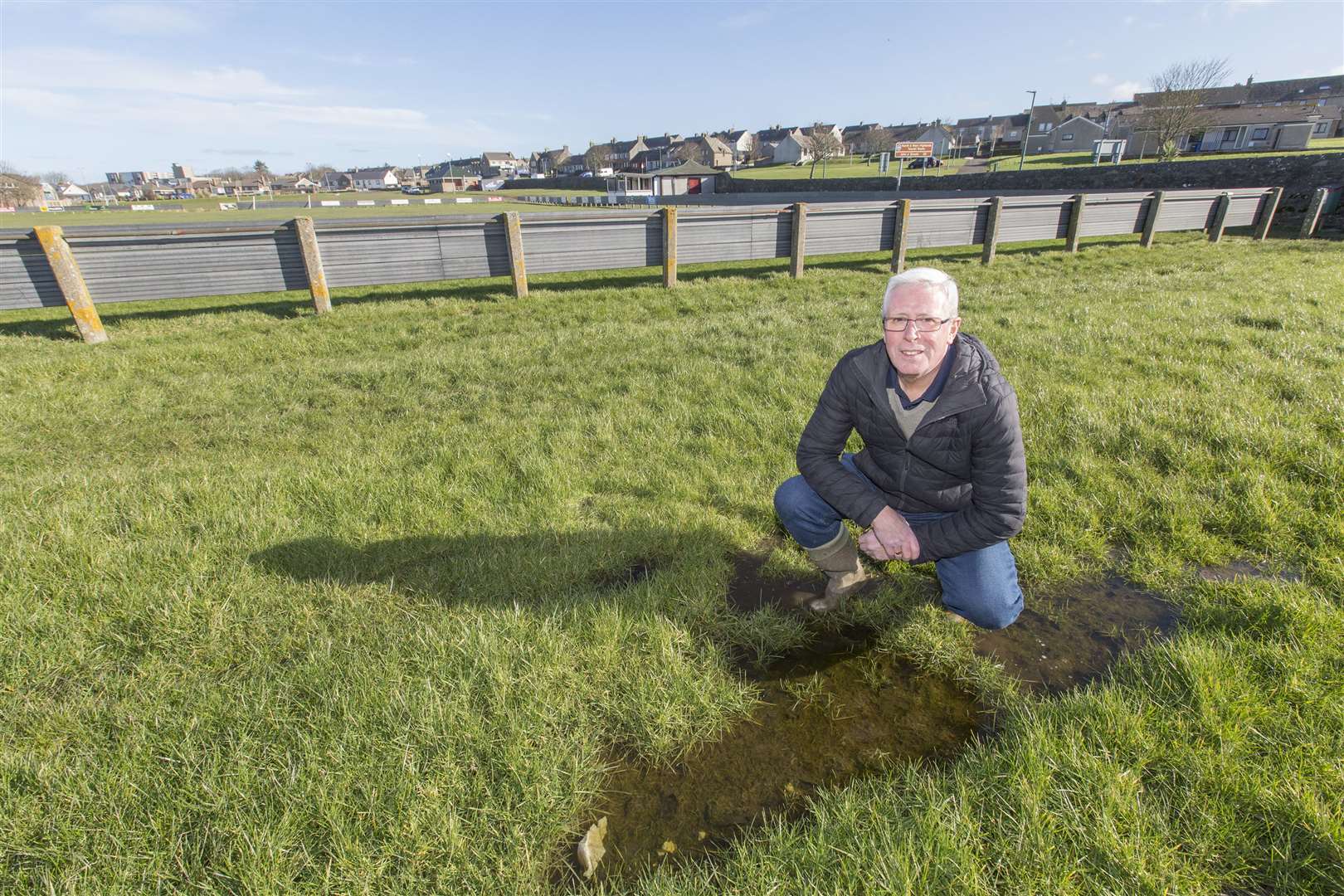 Murray Coghill, president of Caithness AFA, with standing water just a few feet away from the pitch at the Dammies in Thurso. Picture: Robert MacDonald / Northern Studios