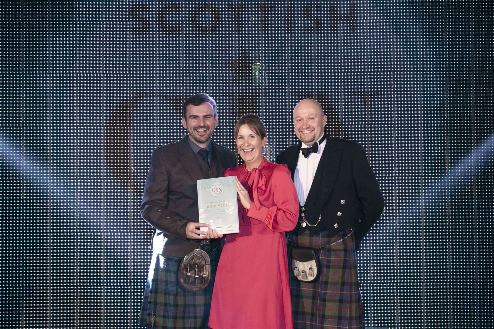 Martin and Claire Murray receiving the Distilled Gin of the Year award from Ron Young of Contract Bottlers Glasgow.