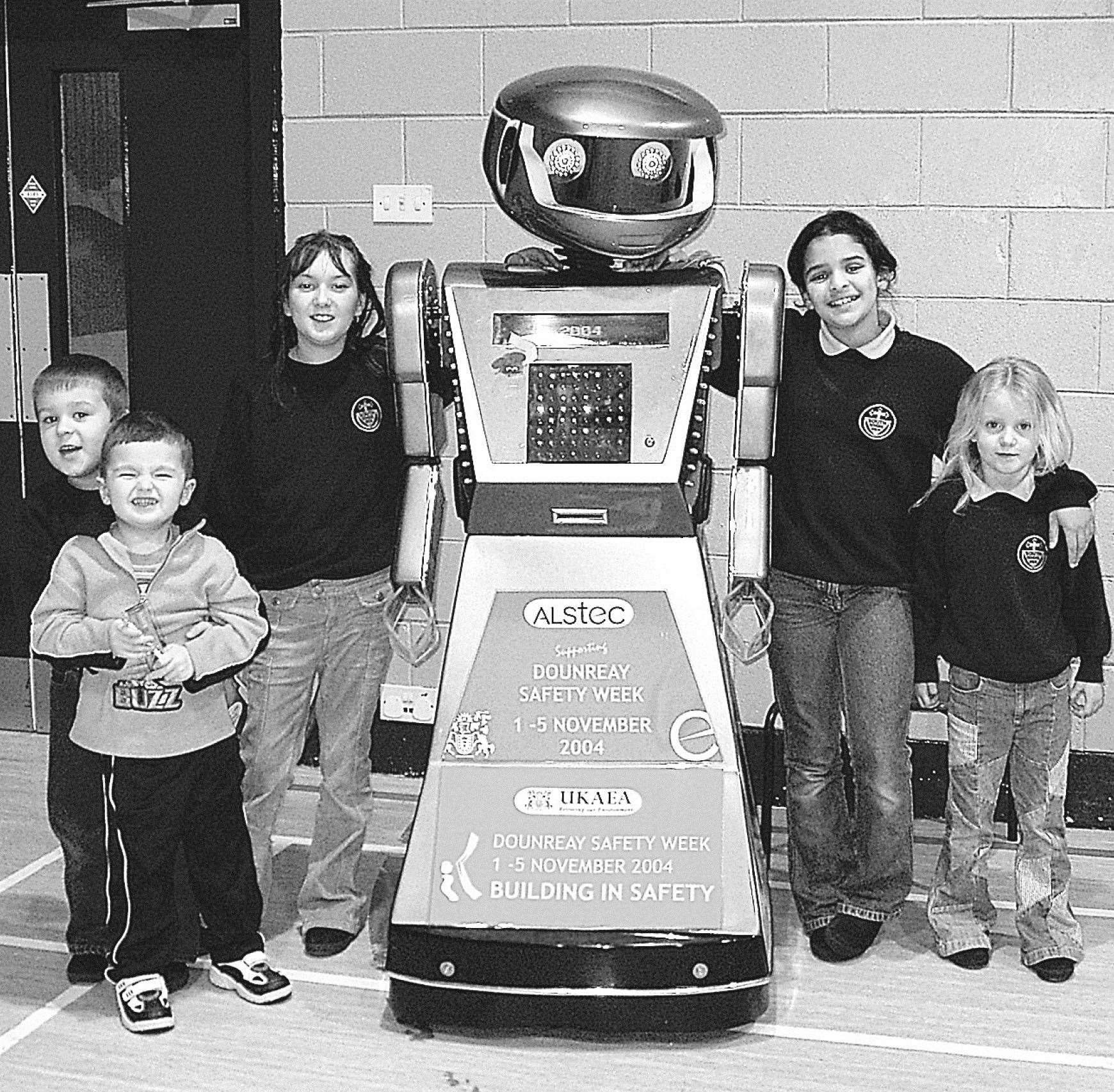 Oscar the robot, belonging to ALSTEC, with pupils at Wick South Primary School as part of Dounreay Safety Week in 2004.