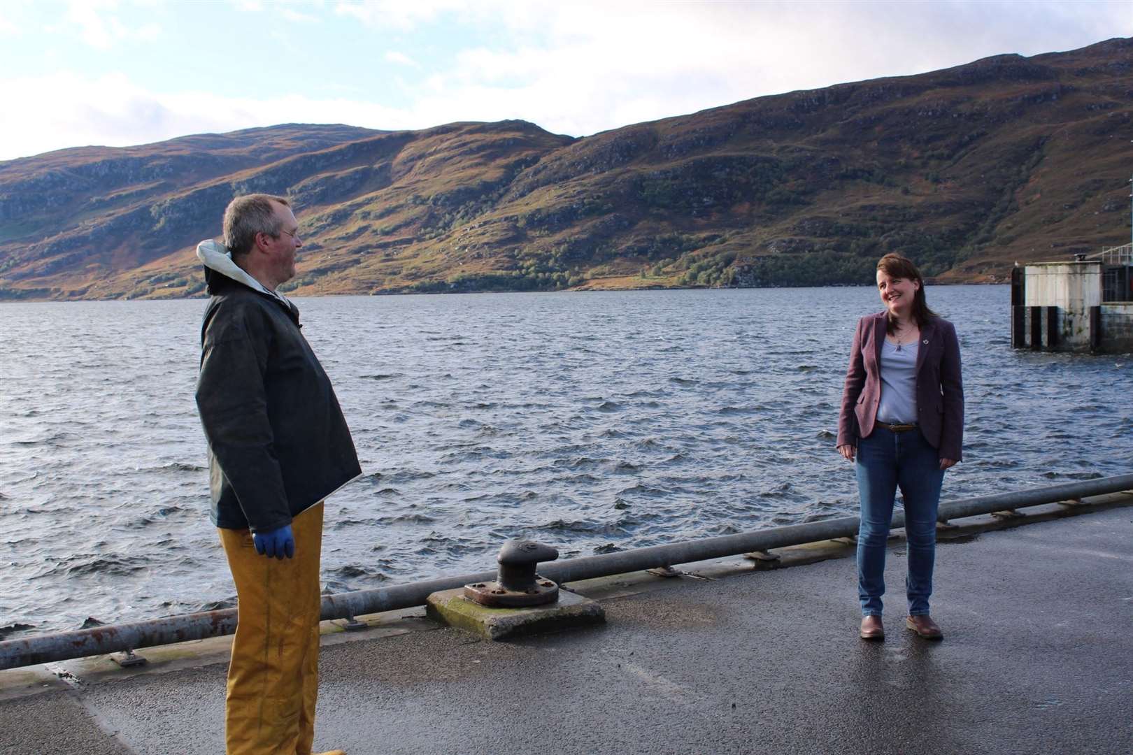 Maree Todd speaking to a fisherman at Ullapool prior to the latest lockdown restrictions.