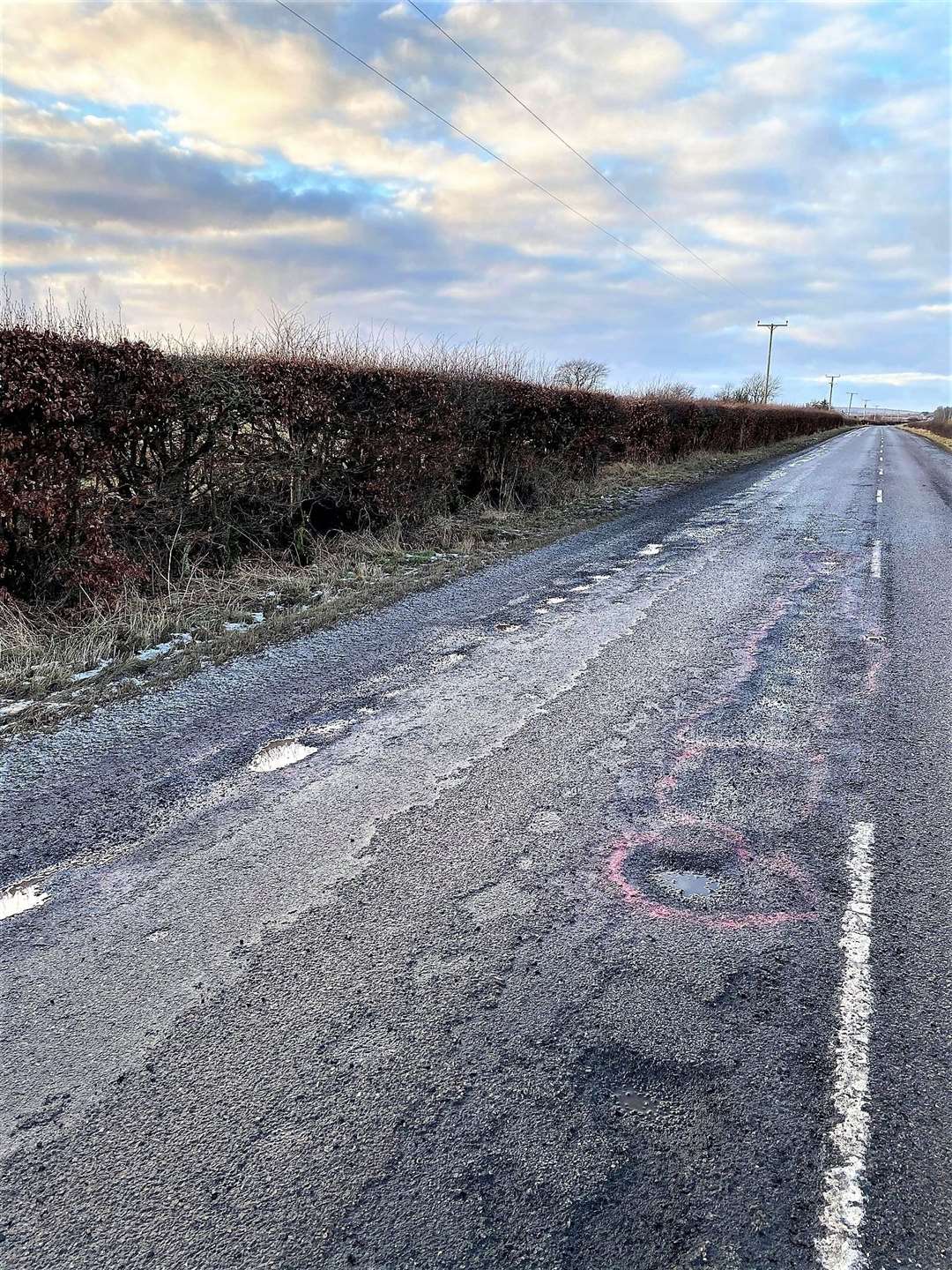 Potholes can be seen on both sides of the A882 in the picture Terri took soon after her accident.