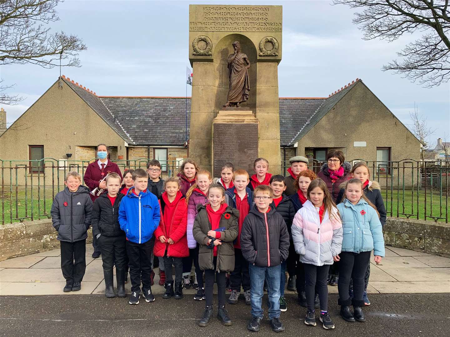 Castletown Primary School pupils at the war memorial in the village on Thursday, Armistice Day.