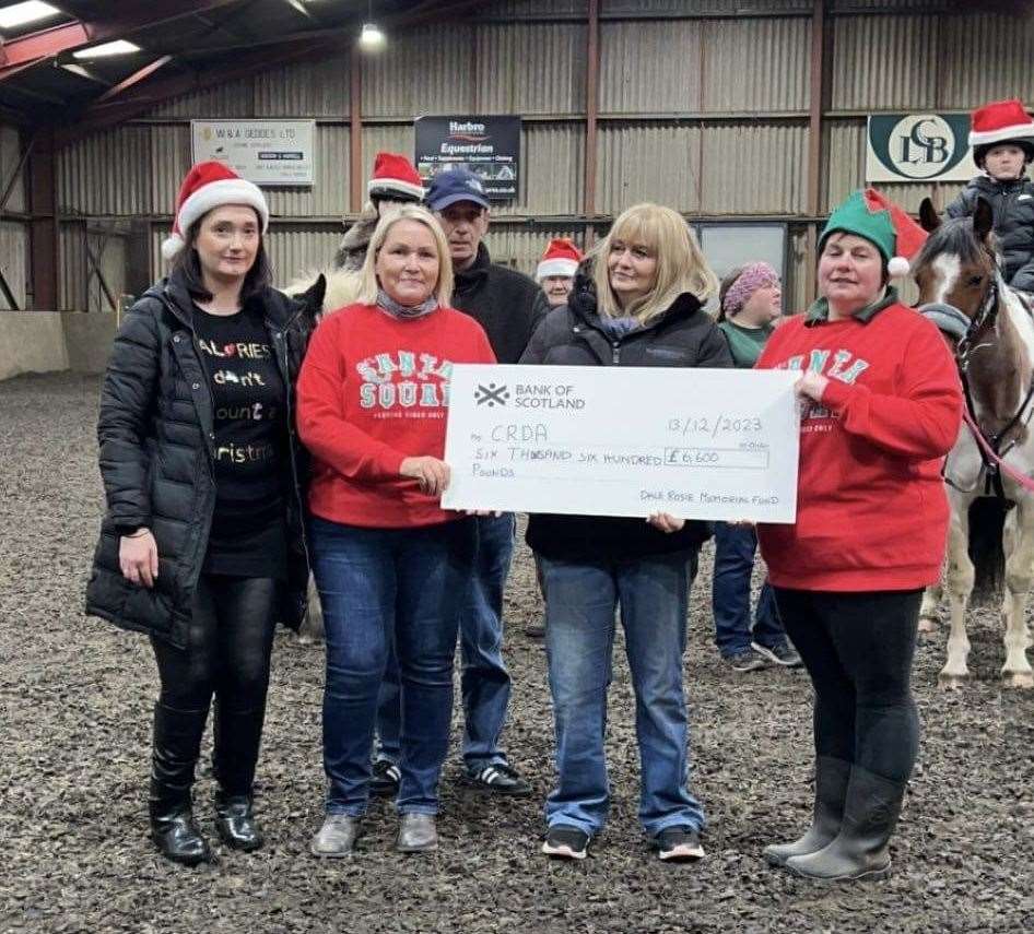 A cheque for £6600 is presented to Caithness RDA. From left: Claire Fraser, Judith Miller, John Rosie, Heather Rosie and Anne Gunn.