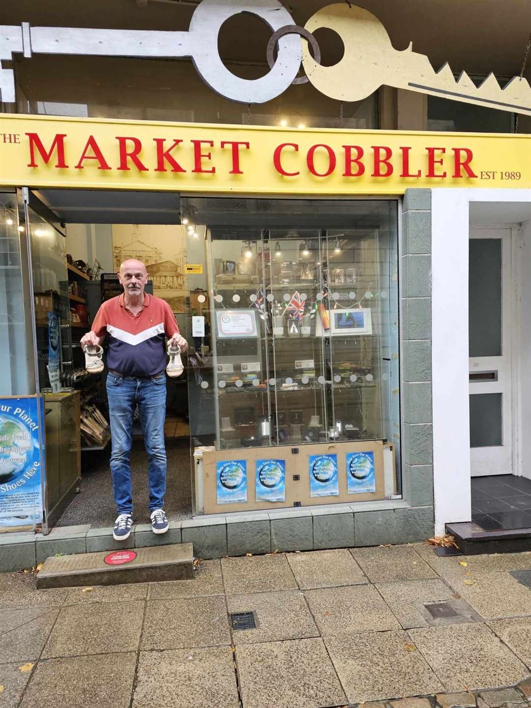 The cobbler said the shoes are ‘back with their rightful owner’ (Peter Corke/PA)